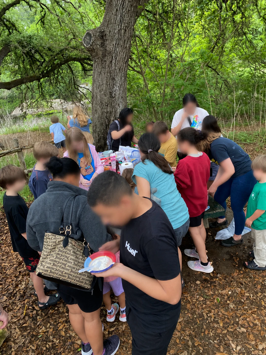 Families creating together during an outdoor CurioSpark workshop